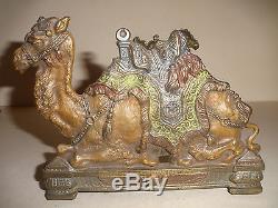 Rare antique cast iron expandable polychrome Egyptian camel figural bookrack